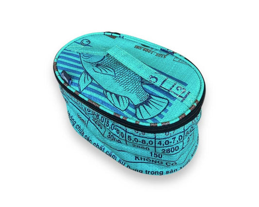 Oval travel pouch. Exterior material is upcycled from feed and cement bags, Interior material is recycled from plastic bottles. Each design is unique.