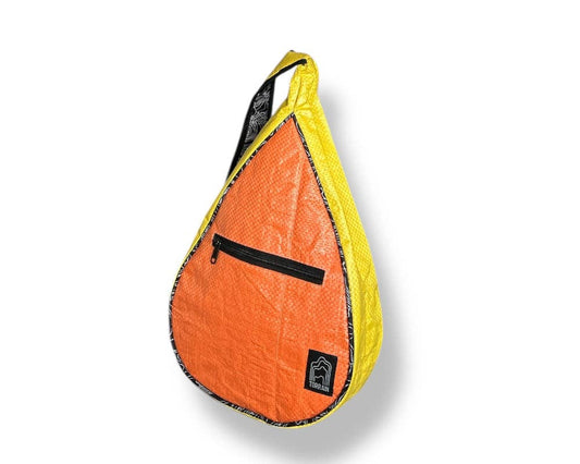 Teardrop shaped sling bag. Exterior material is upcycled from feed and cement bags, Interior material is recycled from plastic bottles. Each design is unique.