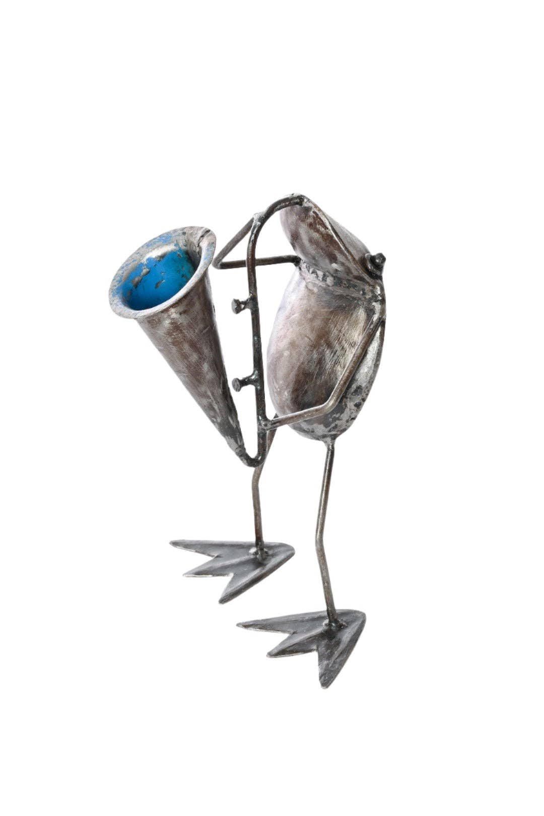 Handcrafted metallic sculpture of a frog playing a horn - facing left