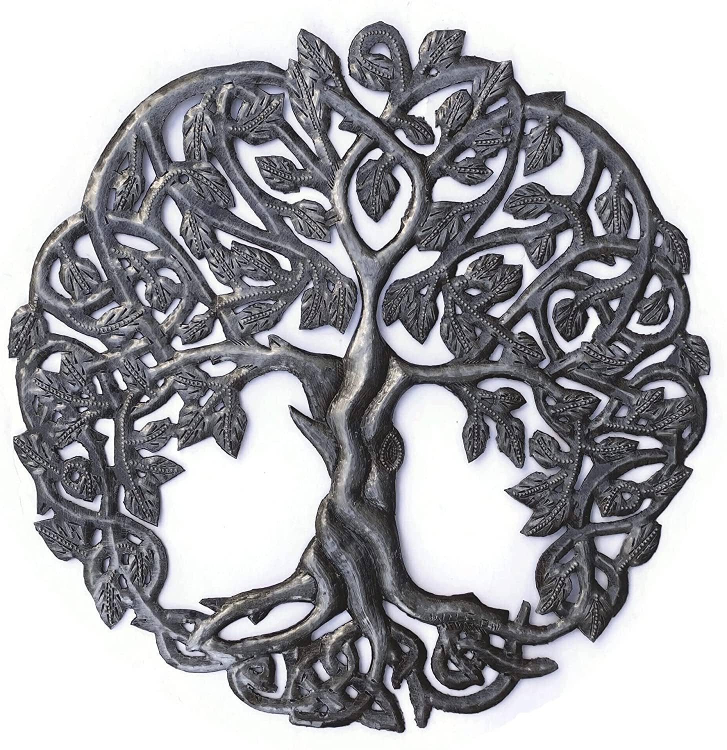Handmade Haitian hammered metal wall art of a tree with intricate designs