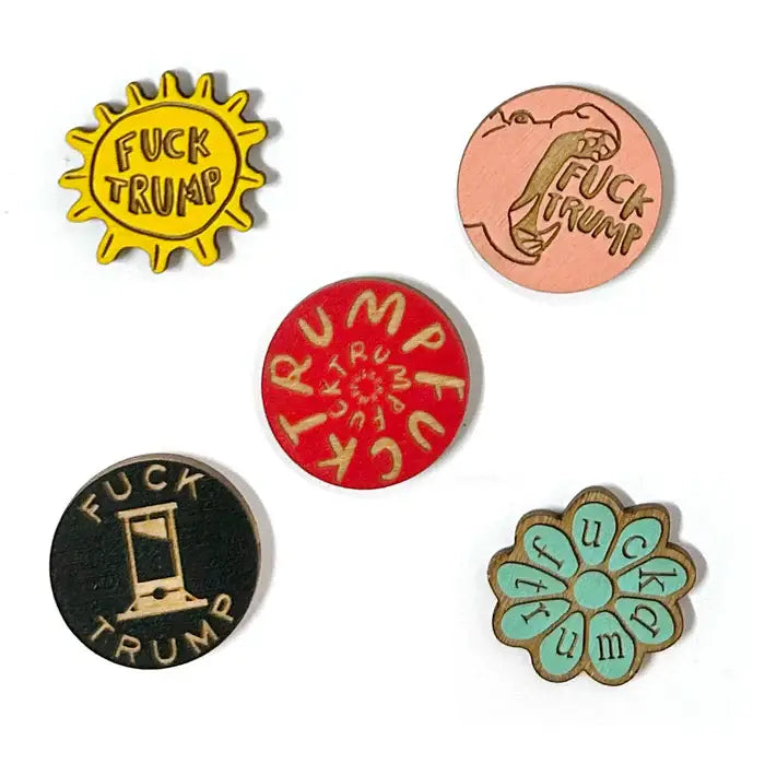 Set of five colorful pins with anti-Trump messages