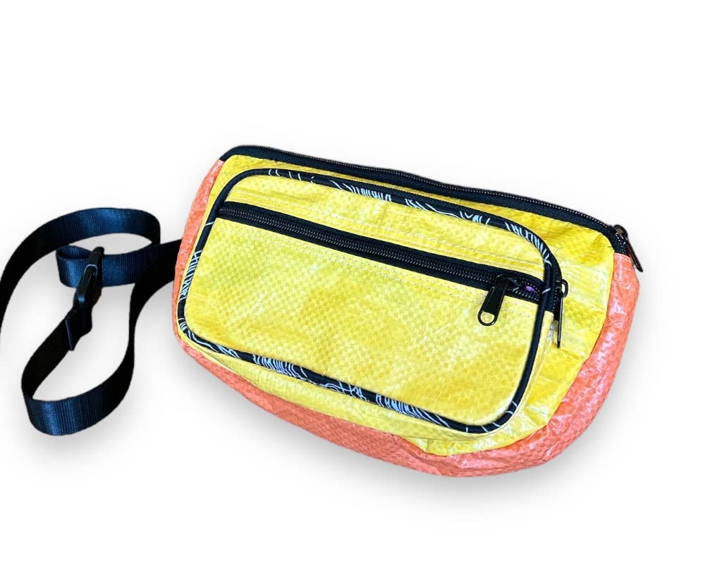 Small cross body pack. Exterior material is upcycled from feed and cement bags, Interior material is recycled from plastic bottles. Each design is unique.