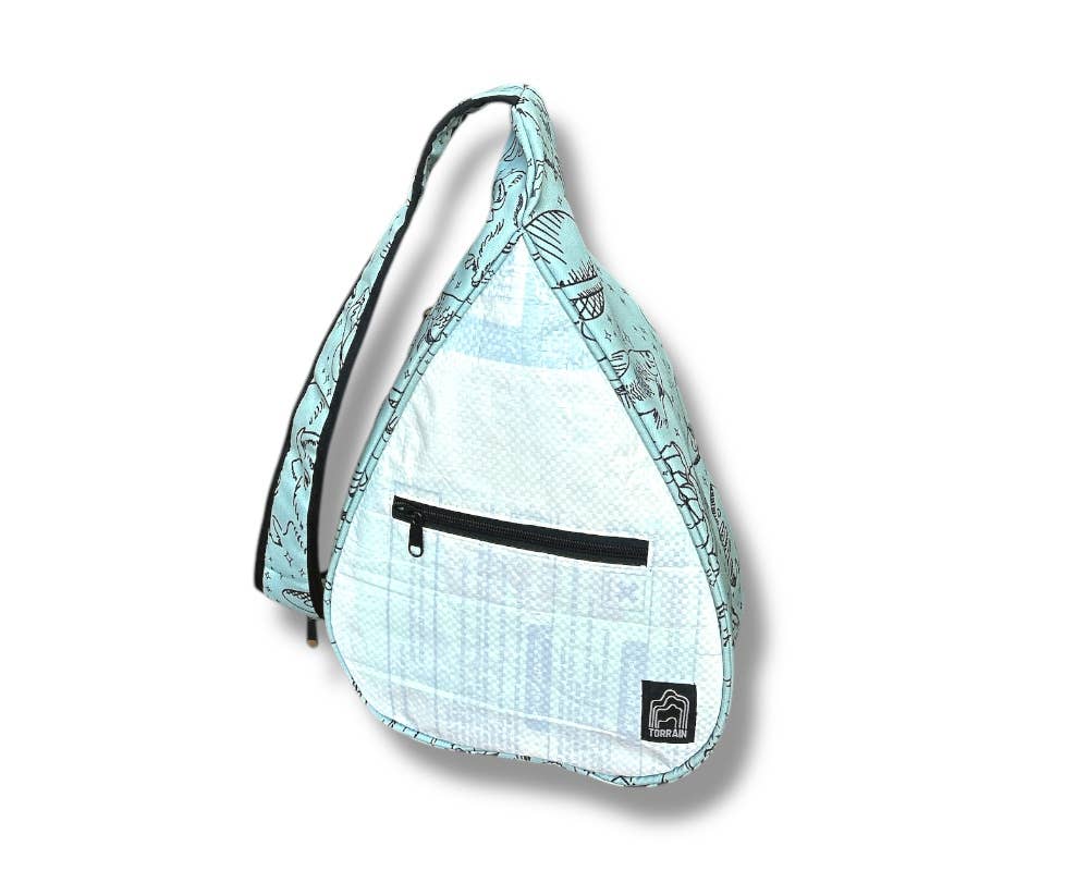 Teardrop shaped sling bag. Exterior material is upcycled from feed and cement bags, Interior material is recycled from plastic bottles. Each design is unique.