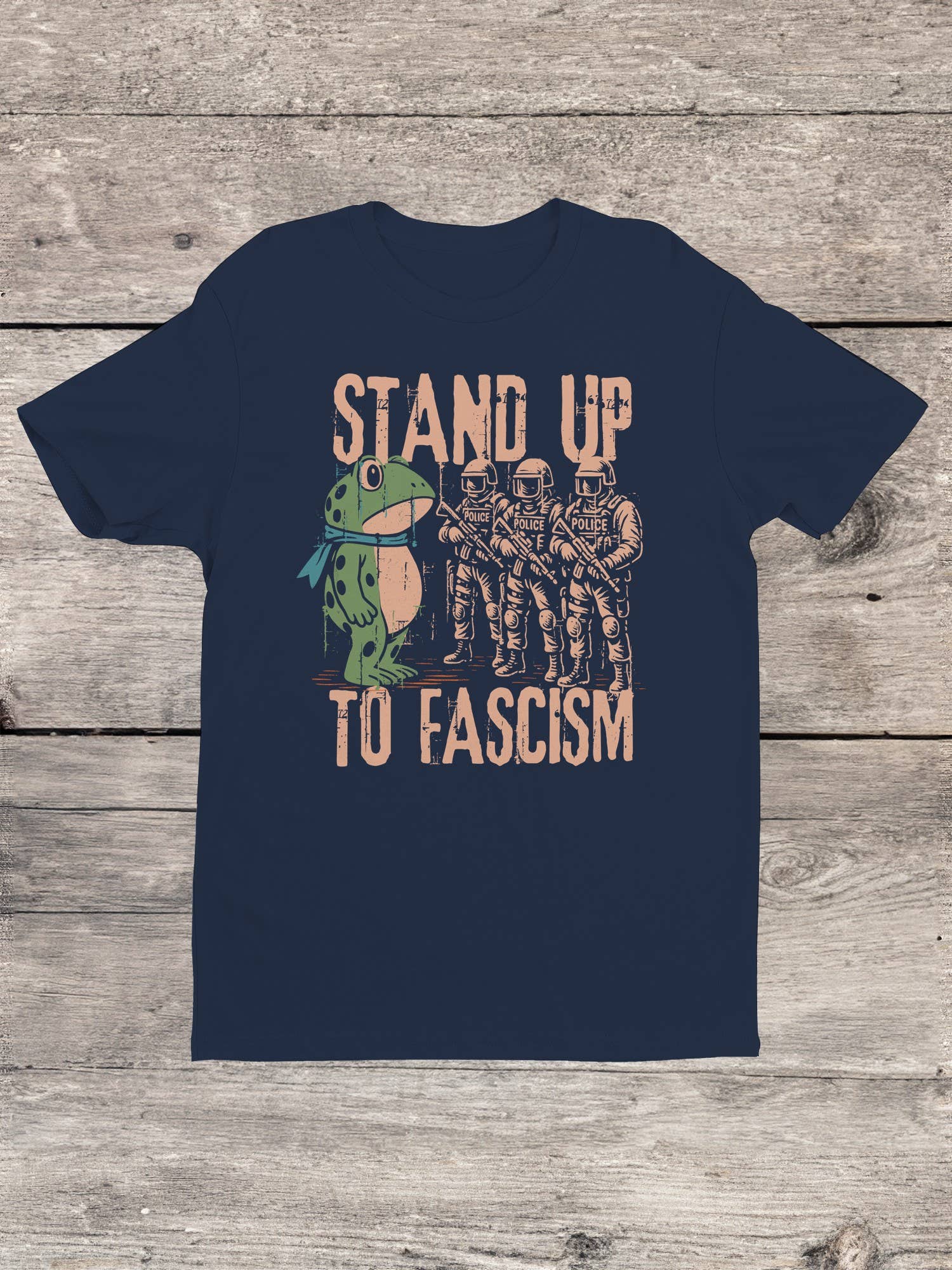 Blue t-shirt with graphic frog protest design and text 'Stand Up To Fascism'
