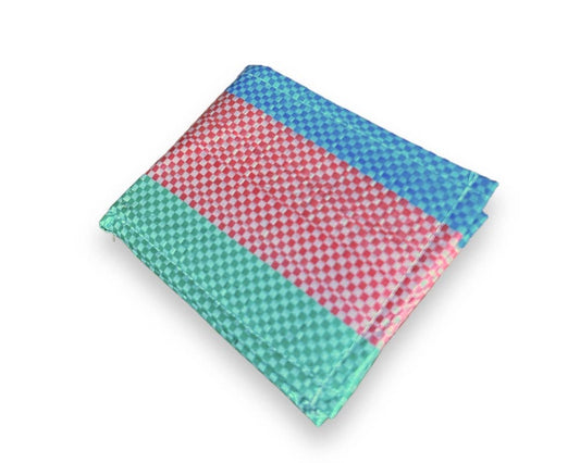 Bi-fold wallet. Exterior material is upcycled from feed and cement bags, Interior material is recycled from plastic bottles. Each design is unique.