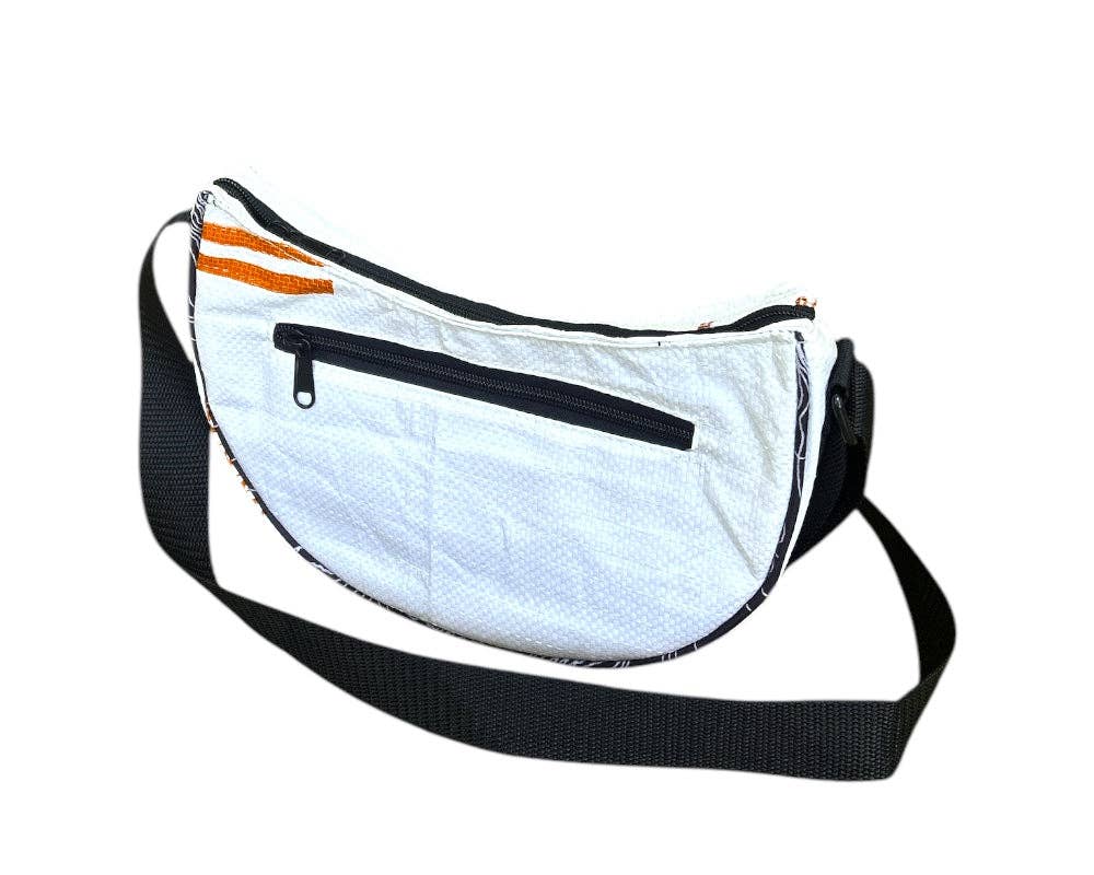 Cross body style bag. Exterior material is upcycled from feed and cement bags, Interior material is recycled from plastic bottles. Each design is unique.