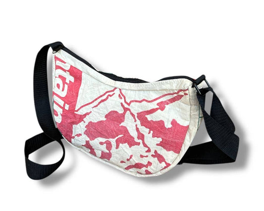 Cross body style bag. Exterior material is upcycled from feed and cement bags, Interior material is recycled from plastic bottles. Each design is unique.