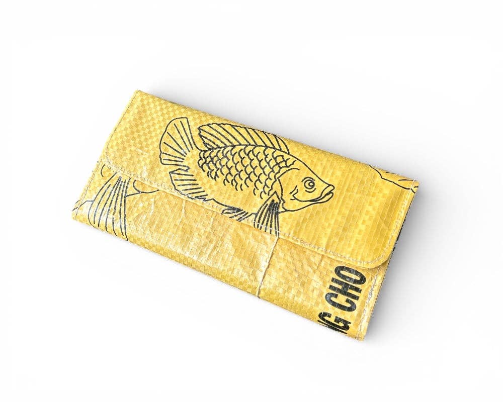 Tri-fold wallet. Exterior material is upcycled from feed and cement bags, Interior material is recycled from plastic bottles. Each design is unique.