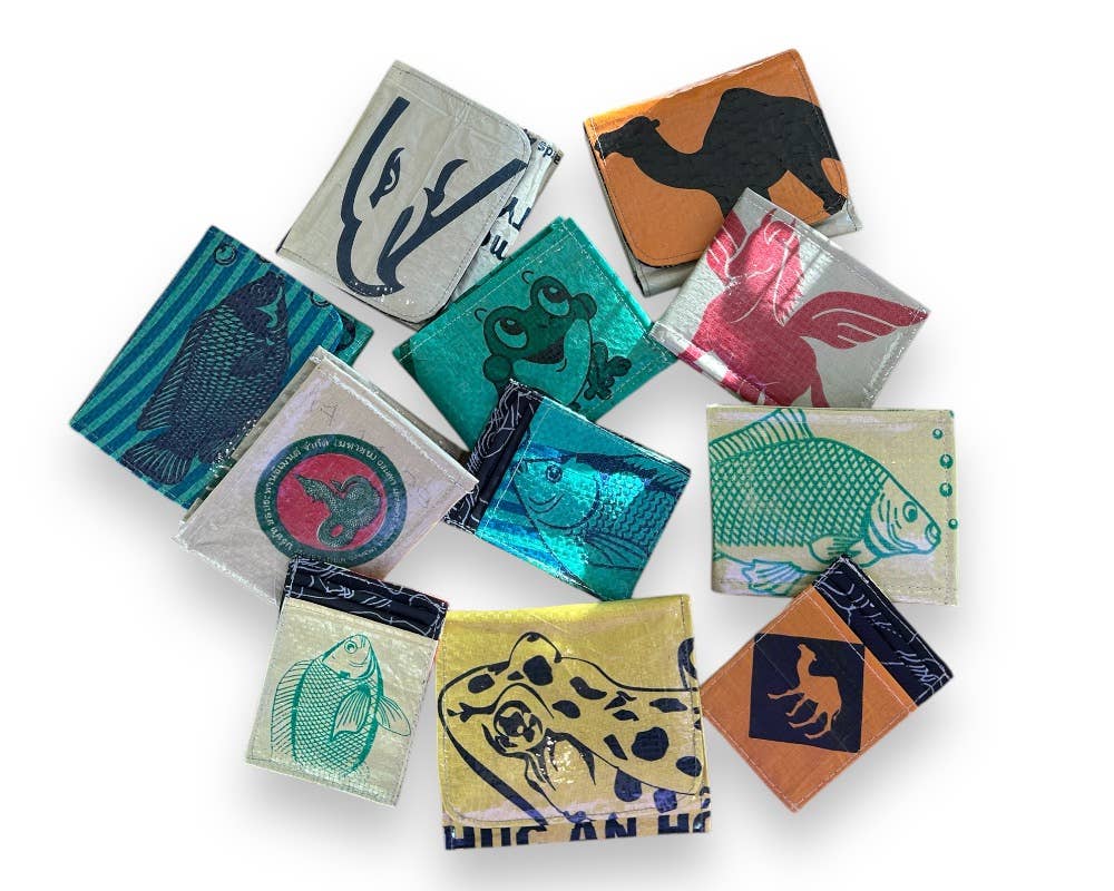 Many bi-fold wallets. Exterior material is upcycled from feed and cement bags, Interior material is recycled from plastic bottles. Each design is unique.