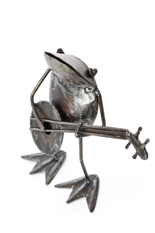 Handcrafted metallic frog, playing a banjo.