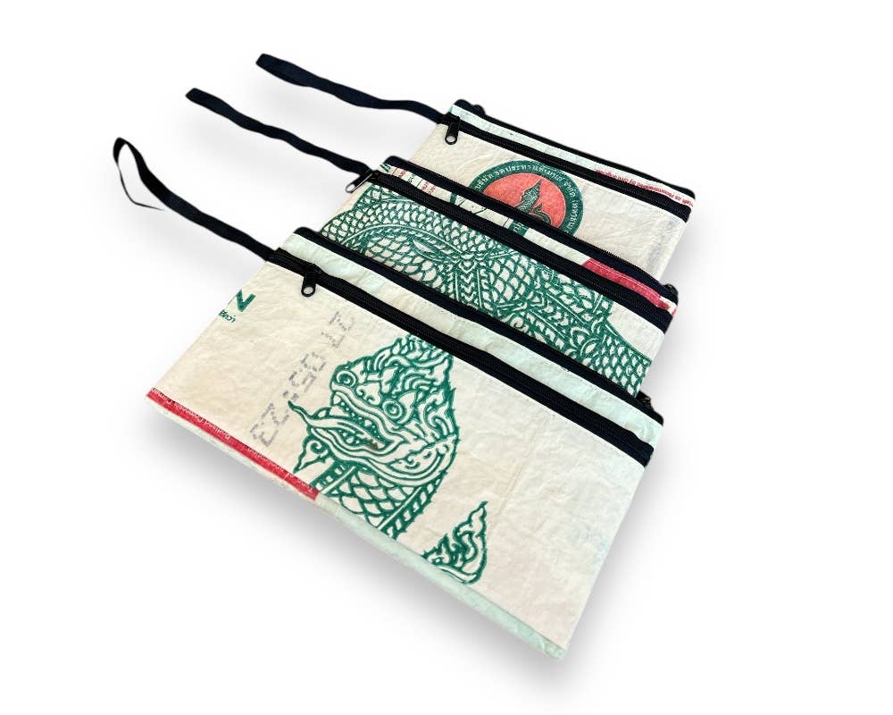 Three pouches of descending size Exterior material is upcycled from feed and cement bags, Interior material is recycled from plastic bottles. Each design is unique.