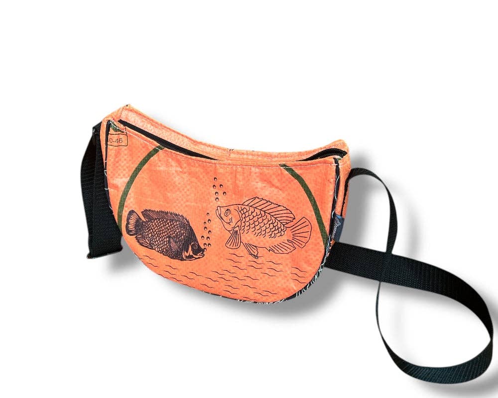 Cross body style bag. Exterior material is upcycled from feed and cement bags, Interior material is recycled from plastic bottles. Each design is unique.