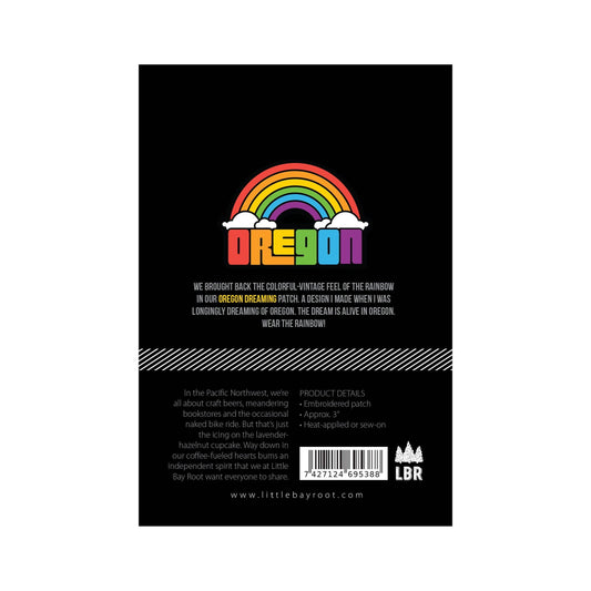 Back of a product packaging with a rainbow design and text on a black background