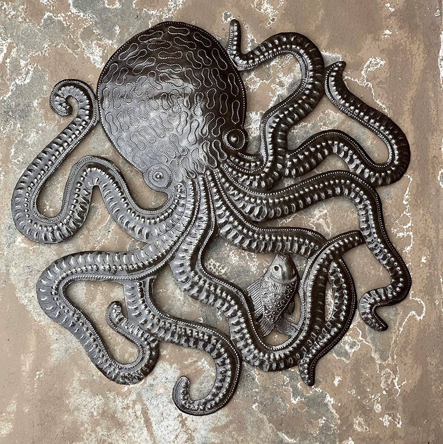 Handmade Haitian hammered metal wall art of an octopus and fish