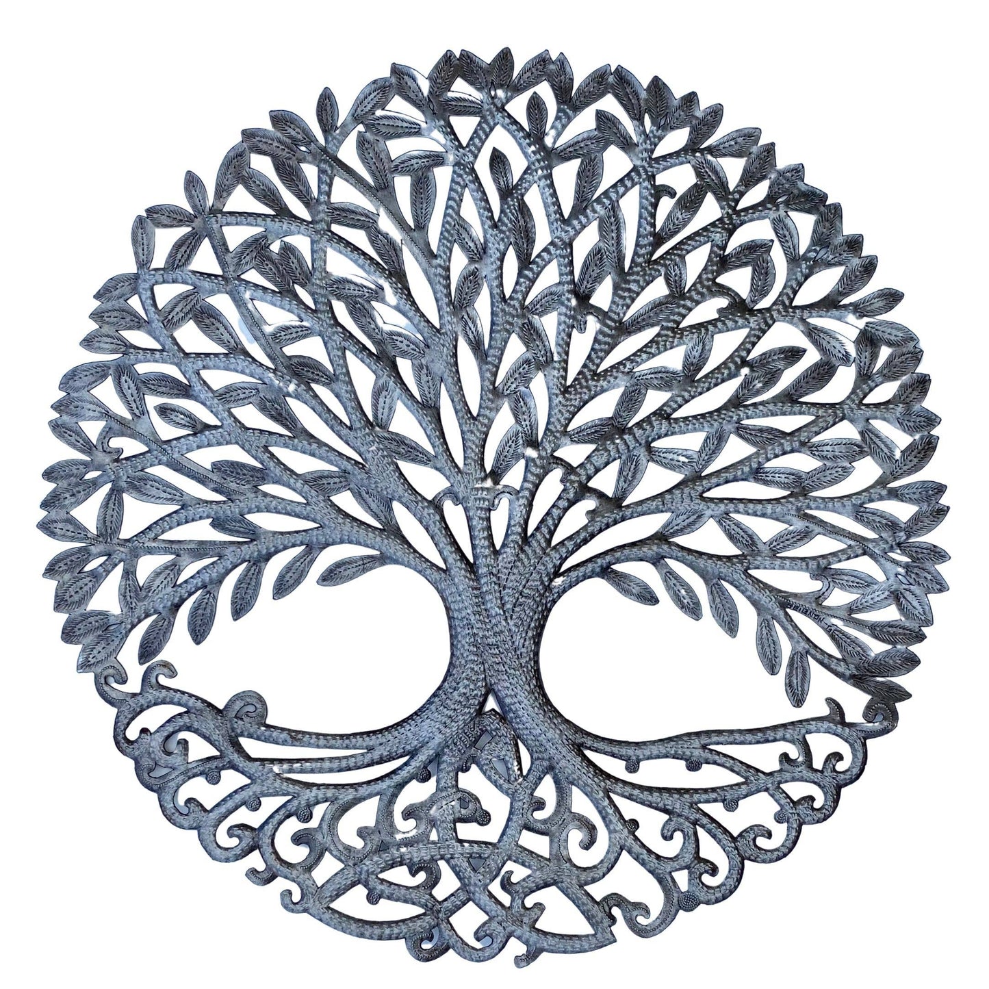 Handmade hammered metal wall art of a tree with intricate designs
