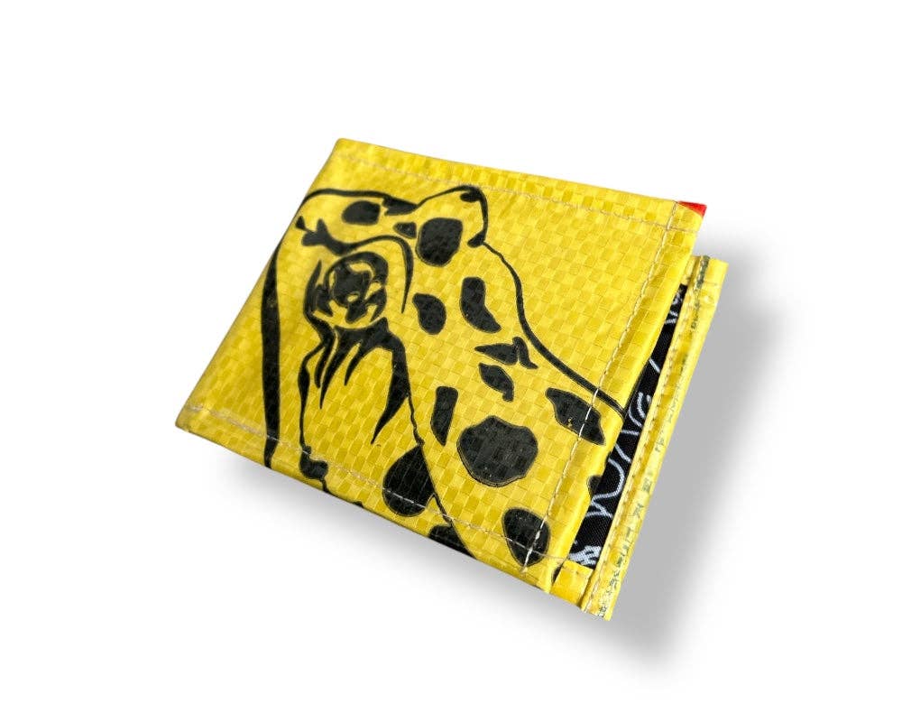 Bi-fold wallet. Exterior material is upcycled from feed and cement bags, Interior material is recycled from plastic bottles. Each design is unique.