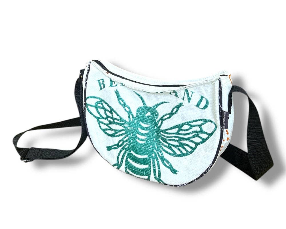 Cross body style bag. Exterior material is upcycled from feed and cement bags, Interior material is recycled from plastic bottles. Each design is unique.