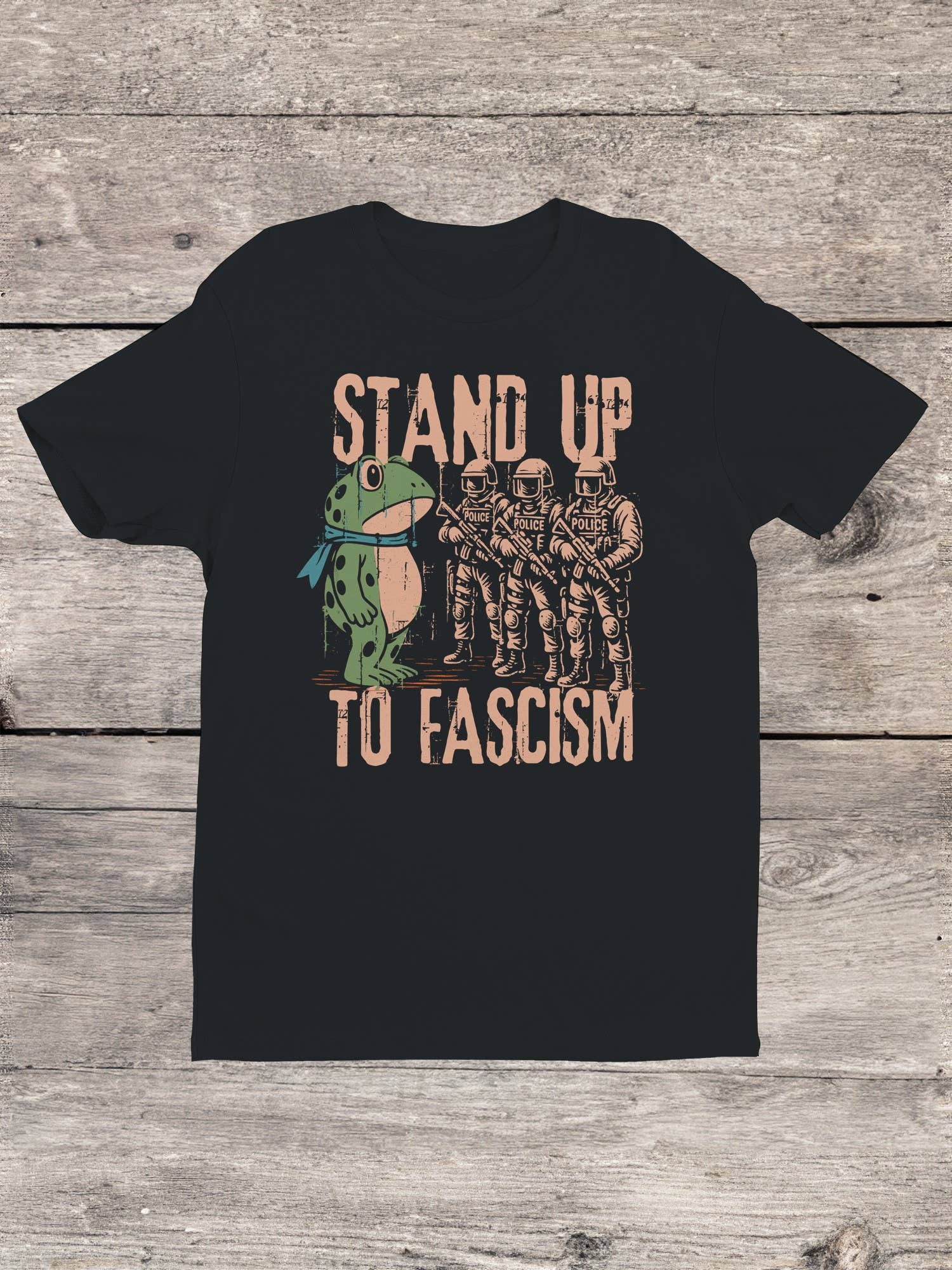 Dark t-shirt with graphic frog protest design and text 'Stand Up To Fascism'