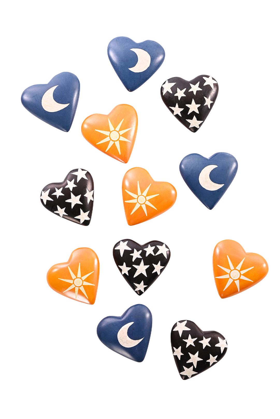 Blue soapstone hearts with white moons, yellow hearts with white suns, and black hearts with white starts.
