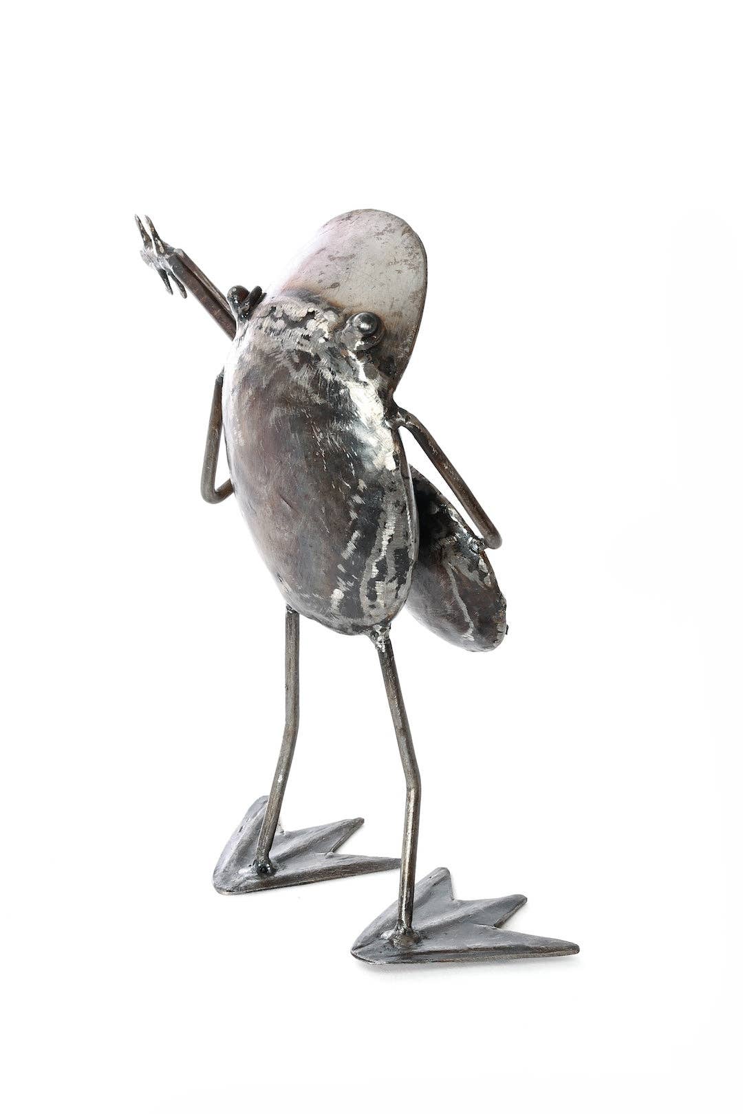 Handcrafted metallic frog, playing a banjo - from the back.