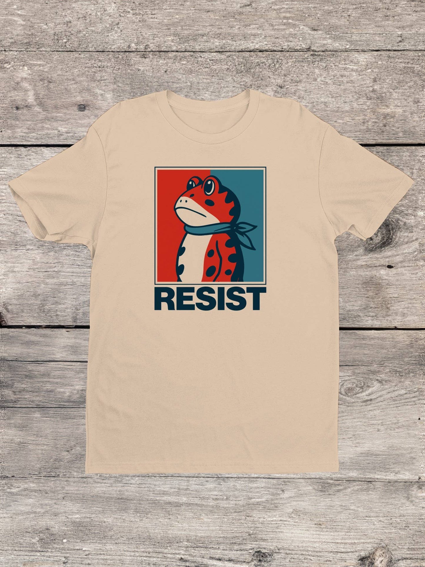Beige protest t-shirt with a frog graphic and 'RESIST'