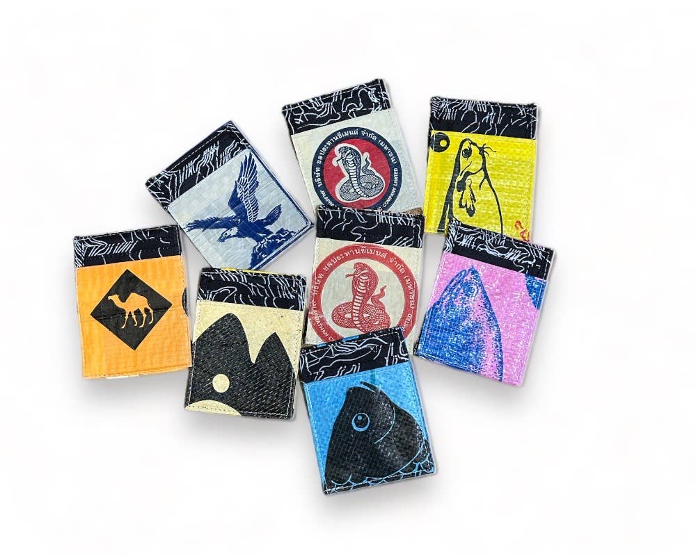 Examples of the mini wallets. Exterior material is upcycled from feed and cement bags, Interior material is recycled from plastic bottles. Each design is unique.