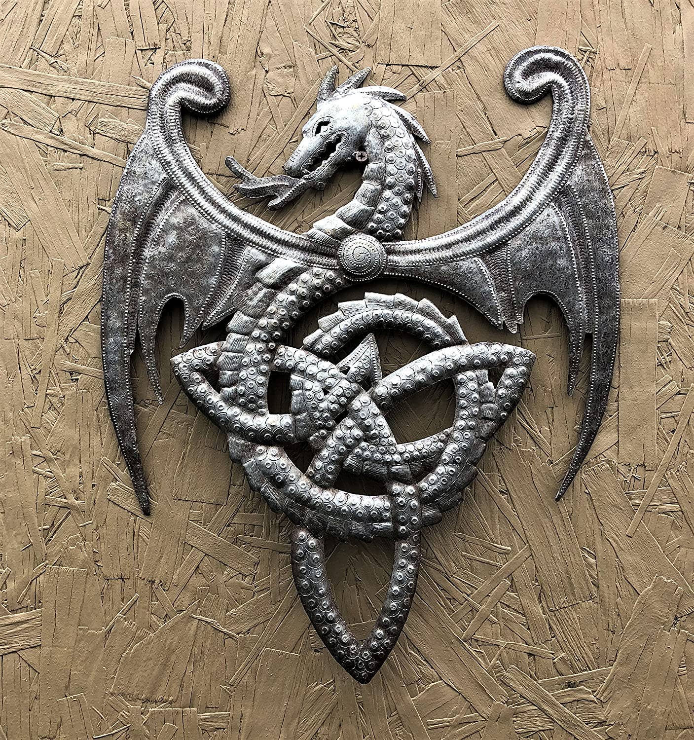 Handmade Haitian hammered metal wall art of a dragon breathing fire