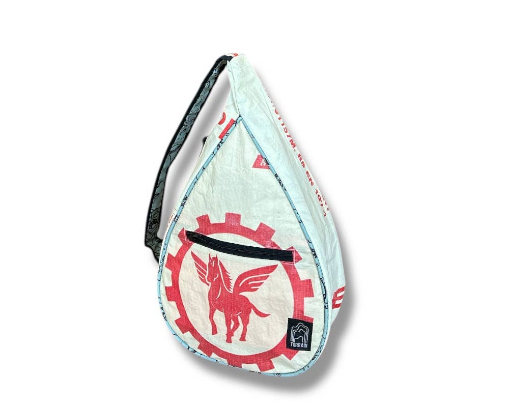 Teardrop shaped sling bag. Exterior material is upcycled from feed and cement bags, Interior material is recycled from plastic bottles. Each design is unique.