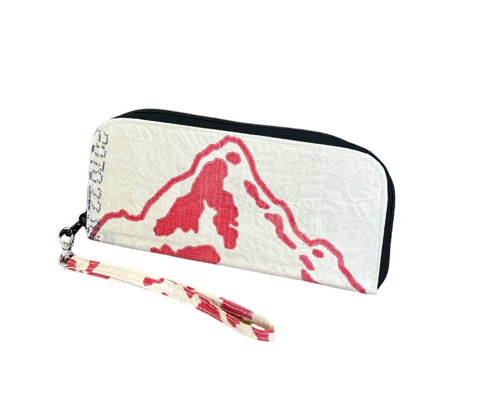 Zip wallet with tassel. Exterior material is upcycled from feed and cement bags, Interior material is recycled from plastic bottles. Each design is unique.