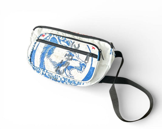 Small cross body pack. Exterior material is upcycled from feed and cement bags, Interior material is recycled from plastic bottles. Each design is unique.