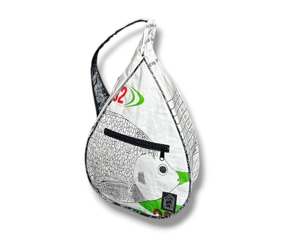 Teardrop shaped sling bag. Exterior material is upcycled from feed and cement bags, Interior material is recycled from plastic bottles. Each design is unique.
