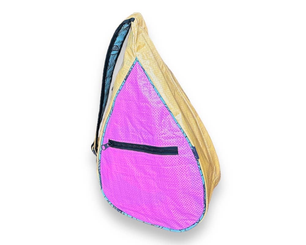 Teardrop shaped sling bag. Exterior material is upcycled from feed and cement bags, Interior material is recycled from plastic bottles. Each design is unique.