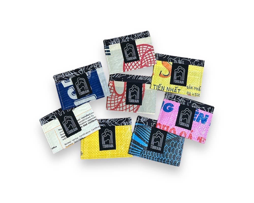 Examples of the mini wallets. Exterior material is upcycled from feed and cement bags, Interior material is recycled from plastic bottles. Each design is unique.
