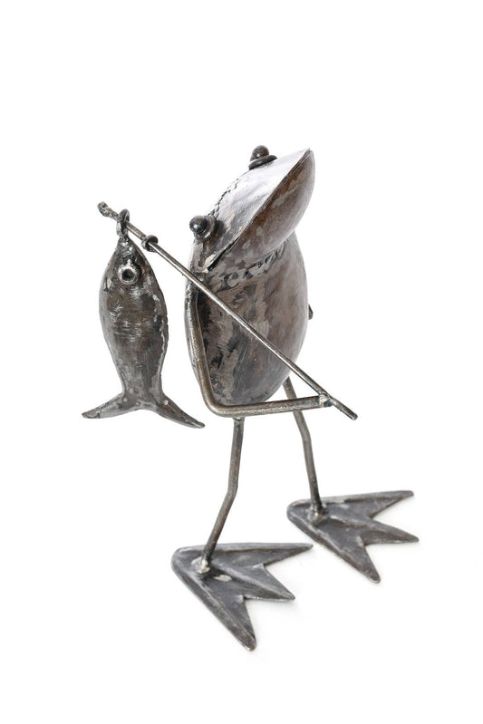 Metallic frog  holding a fishing pole with a fish on the end