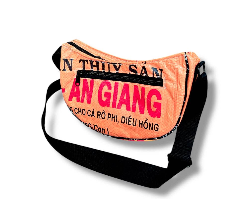 Cross body style bag. Exterior material is upcycled from feed and cement bags, Interior material is recycled from plastic bottles. Each design is unique.