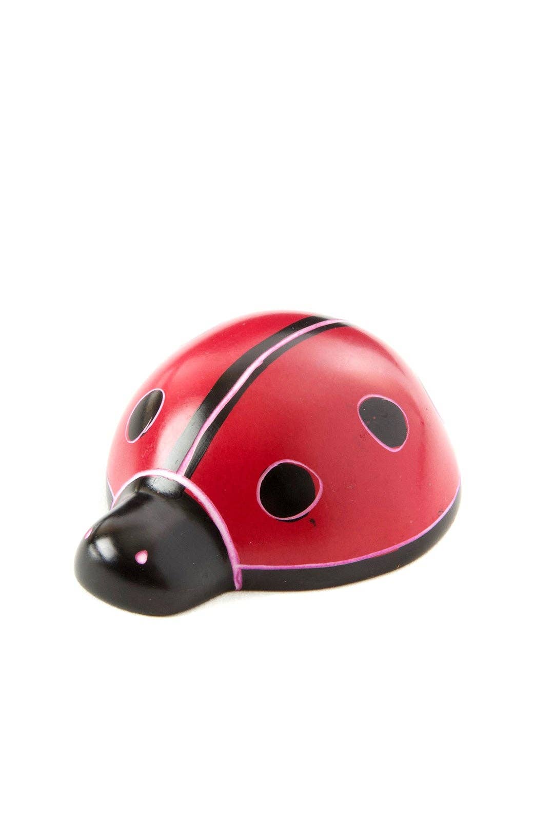 Close up of a single handcrafted soapstone ladybug. 