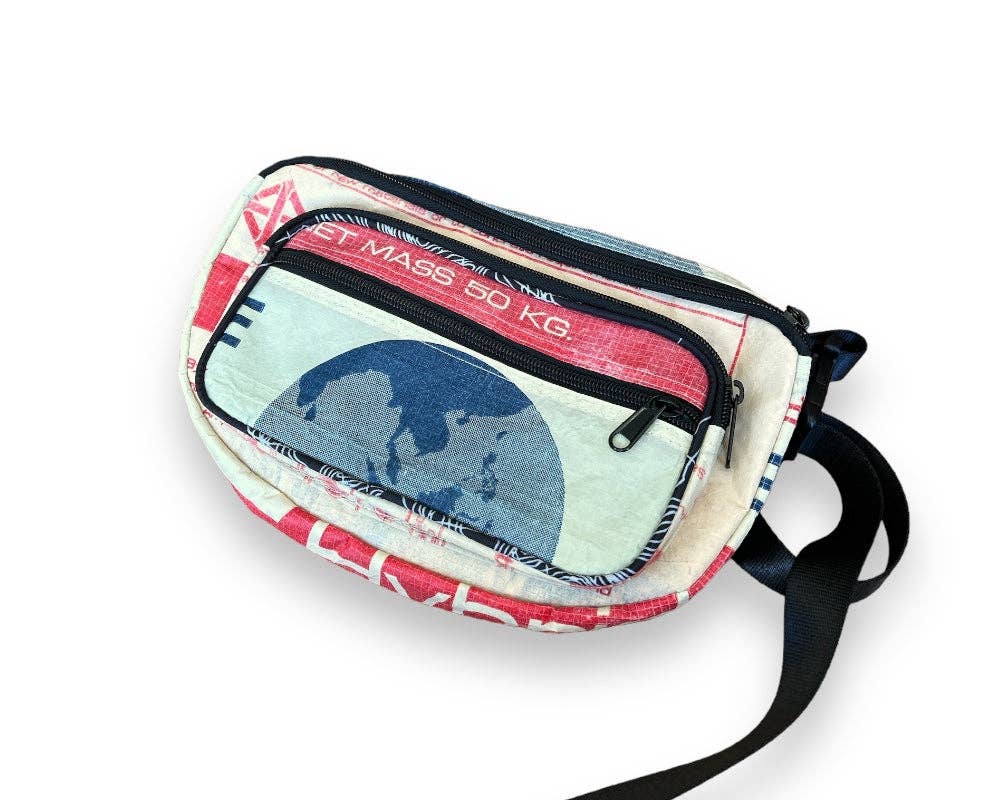 Small cross body pack. Exterior material is upcycled from feed and cement bags, Interior material is recycled from plastic bottles. Each design is unique.