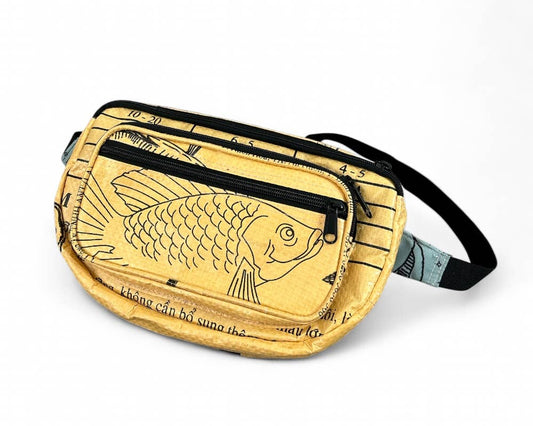 Small cross body pack. Exterior material is upcycled from feed and cement bags, Interior material is recycled from plastic bottles. Each design is unique.