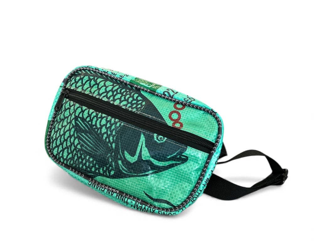 Fanny/Hip style bag. Exterior material is upcycled from feed and cement bags, Interior material is recycled from plastic bottles. Each design is unique.