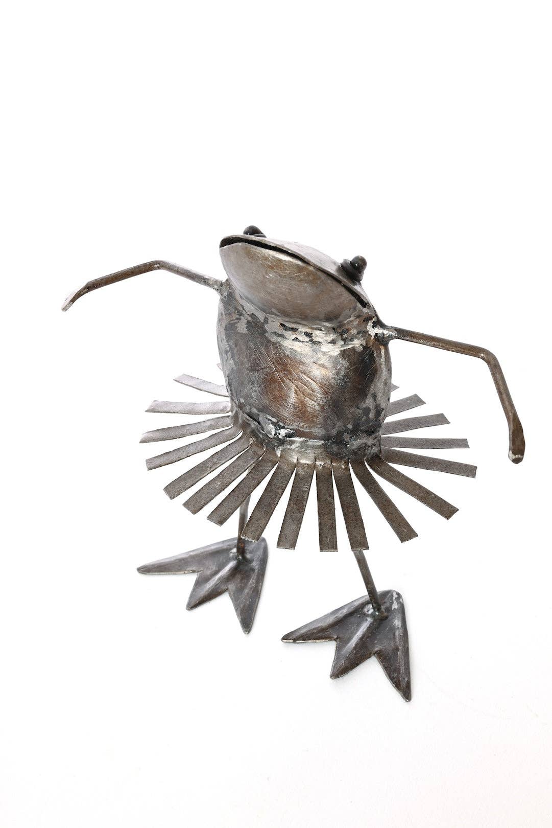 Metallic dancing frog with a swirling skirt - facing left.