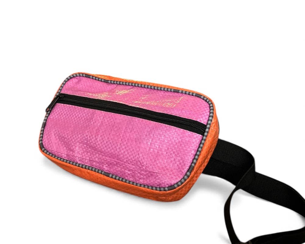 Fanny/Hip style bag. Exterior material is upcycled from feed and cement bags, Interior material is recycled from plastic bottles. Each design is unique.
