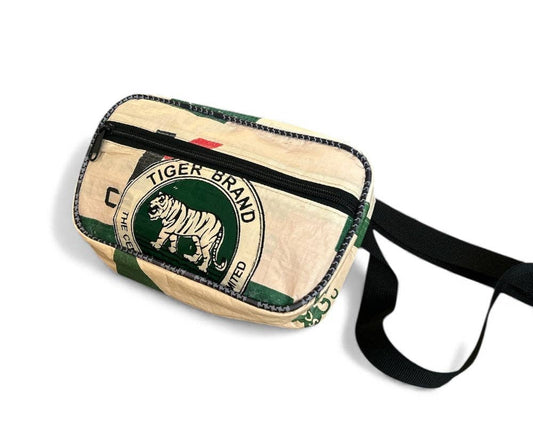Fanny/Hip style bag. Exterior material is upcycled from feed and cement bags, Interior material is recycled from plastic bottles. Each design is unique.